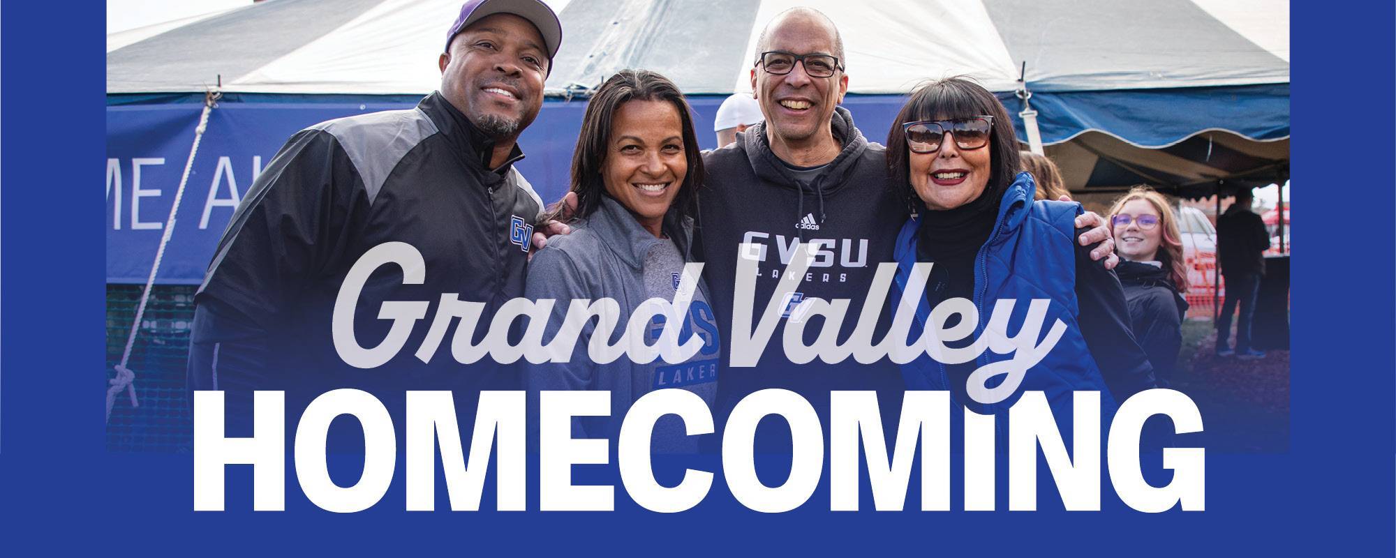 Alumni pose with President Mantella during the Homecoming tailgate